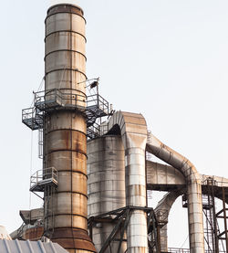 Low angle view of factory against clear sky