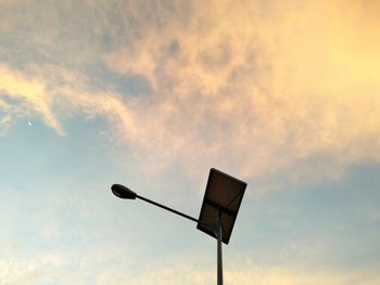 Low angle view of street light against sky