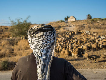 Man on desert against sky