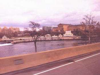 View of buildings against cloudy sky