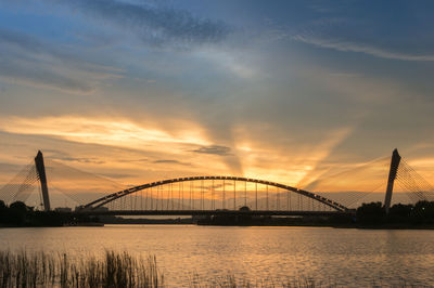 Silhouette of bridge at sunset