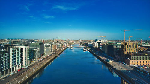 High angle view of canal amidst buildings in city