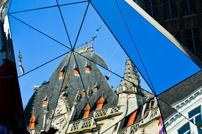 Low angle view of building against blue sky