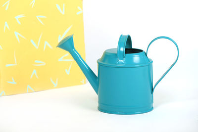 Close-up of container against yellow background