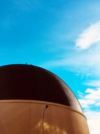 Low angle view of building against blue sky