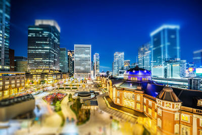 Illuminated buildings in city at night