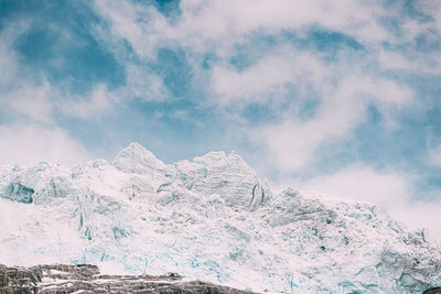 Scenic view of snowcapped mountain against sky