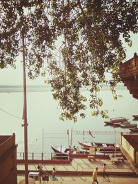 Boats moored at harbor