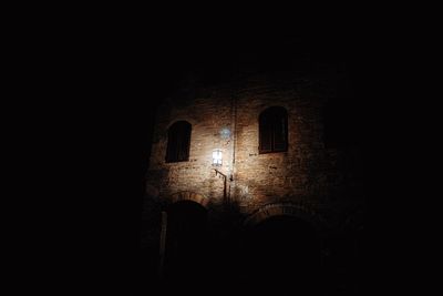 Low angle view of old building at night