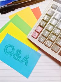 High angle view of multi colored paper on table