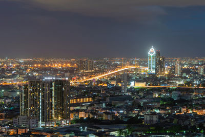 Aerial view of illuminated city buildings at night