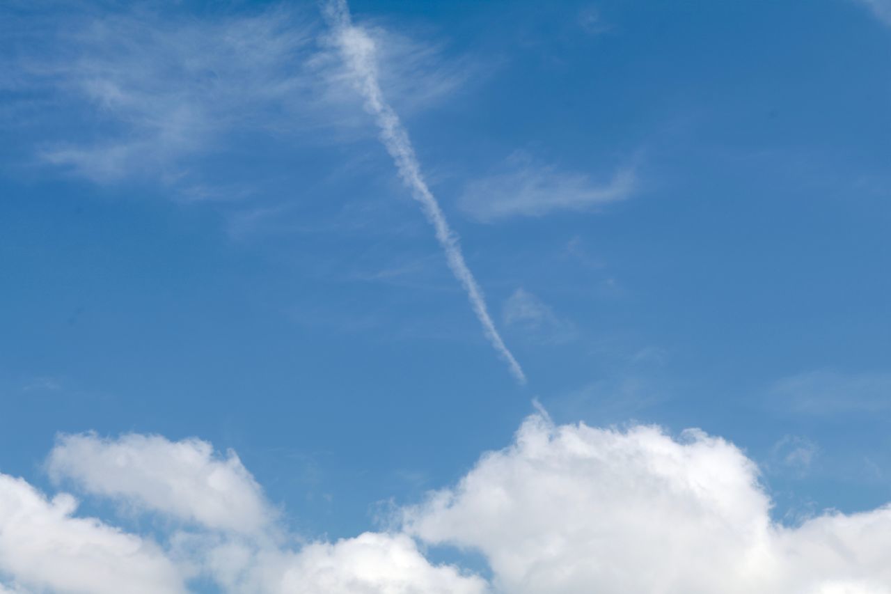 LOW ANGLE VIEW OF VAPOR TRAIL AGAINST SKY