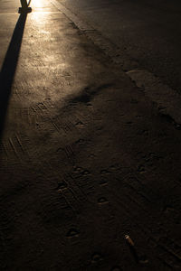 High angle view of footprints on road