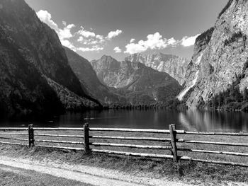 Rear view of man on lake against mountains