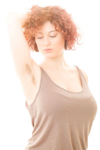 Portrait of a beautiful young woman over white background