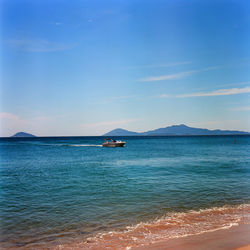 Scenic view of sea against blue sky