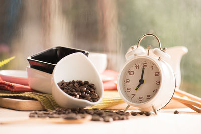 Close-up of clock on table