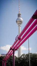 Low angle view of communications tower against sky