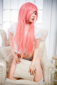 Young woman lying on bed