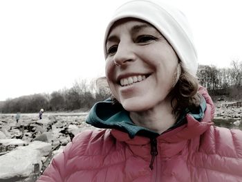 Portrait of smiling woman in snow