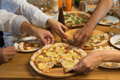 Midsection of woman preparing food on table