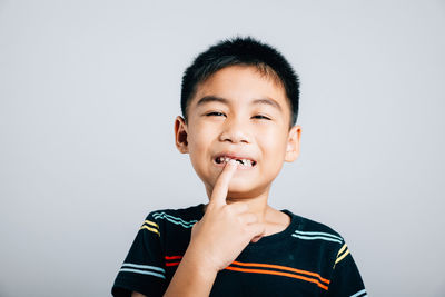 Portrait of young man against white background