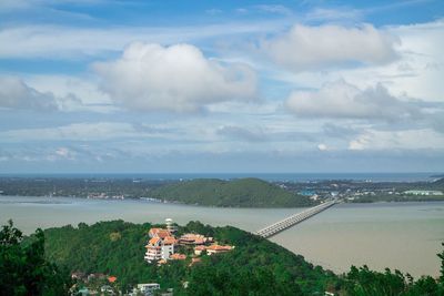 High angle view of buildings and sea against sky