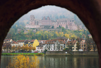 Buildings seen through arch bridge