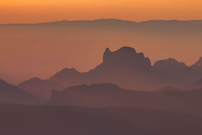 Layer of mountains with misty in morning