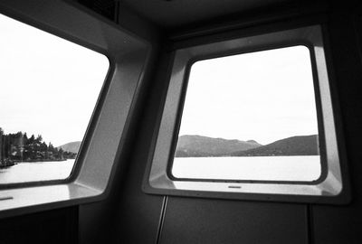 Close-up of train window against clear sky