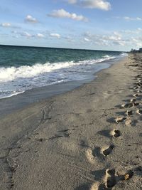 Scenic view of beach against sky