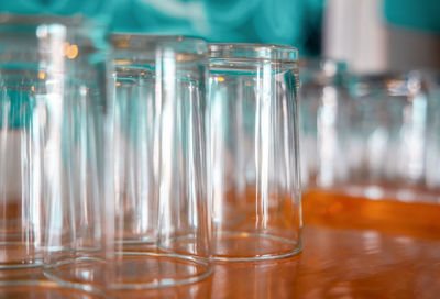 Close-up of empty glasses on table