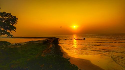 Scenic view of sea at sunset