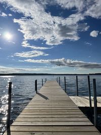 Pier over sea against sky