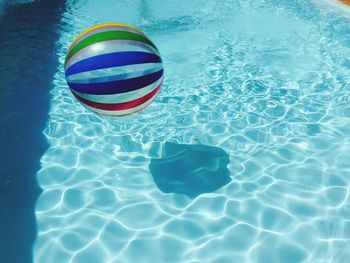 Inflatable ball in swimming pool