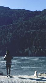 Full length of woman standing on mountain