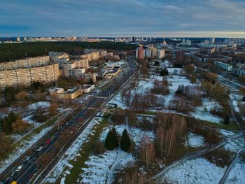 High angle view of bridge over river in city against sky