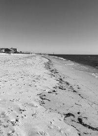 Scenic view of beach against clear sky