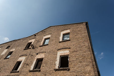 Low angle view of building against clear blue sky