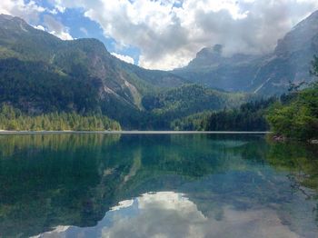 Scenic view of lake and mountains against sky