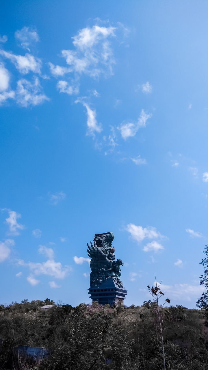 LOW ANGLE VIEW OF STATUE AGAINST BLUE SKY AND CLOUDS