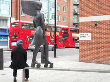 Rear view of people on city street