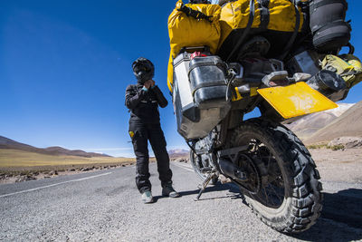 Woman getting ready to ride her touring motorcycle in chile