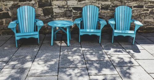 Empty chairs and tables in row