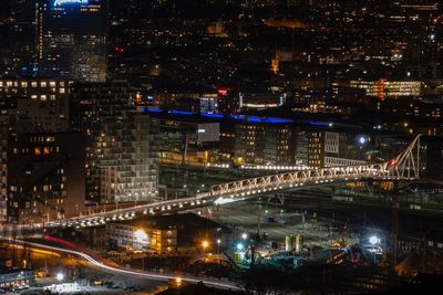 High angle view of illuminated street and buildings at night