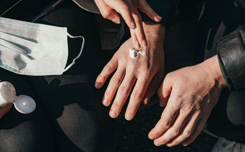 High angle view of people on hands