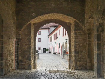 Empty alley amidst buildings