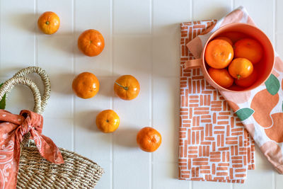 High angle view of fruits in basket on table