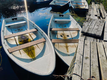 High angle view of abandoned boats moored at lake