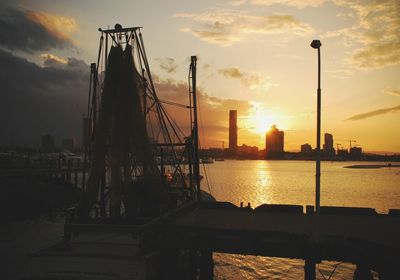 View of harbor at sunset
